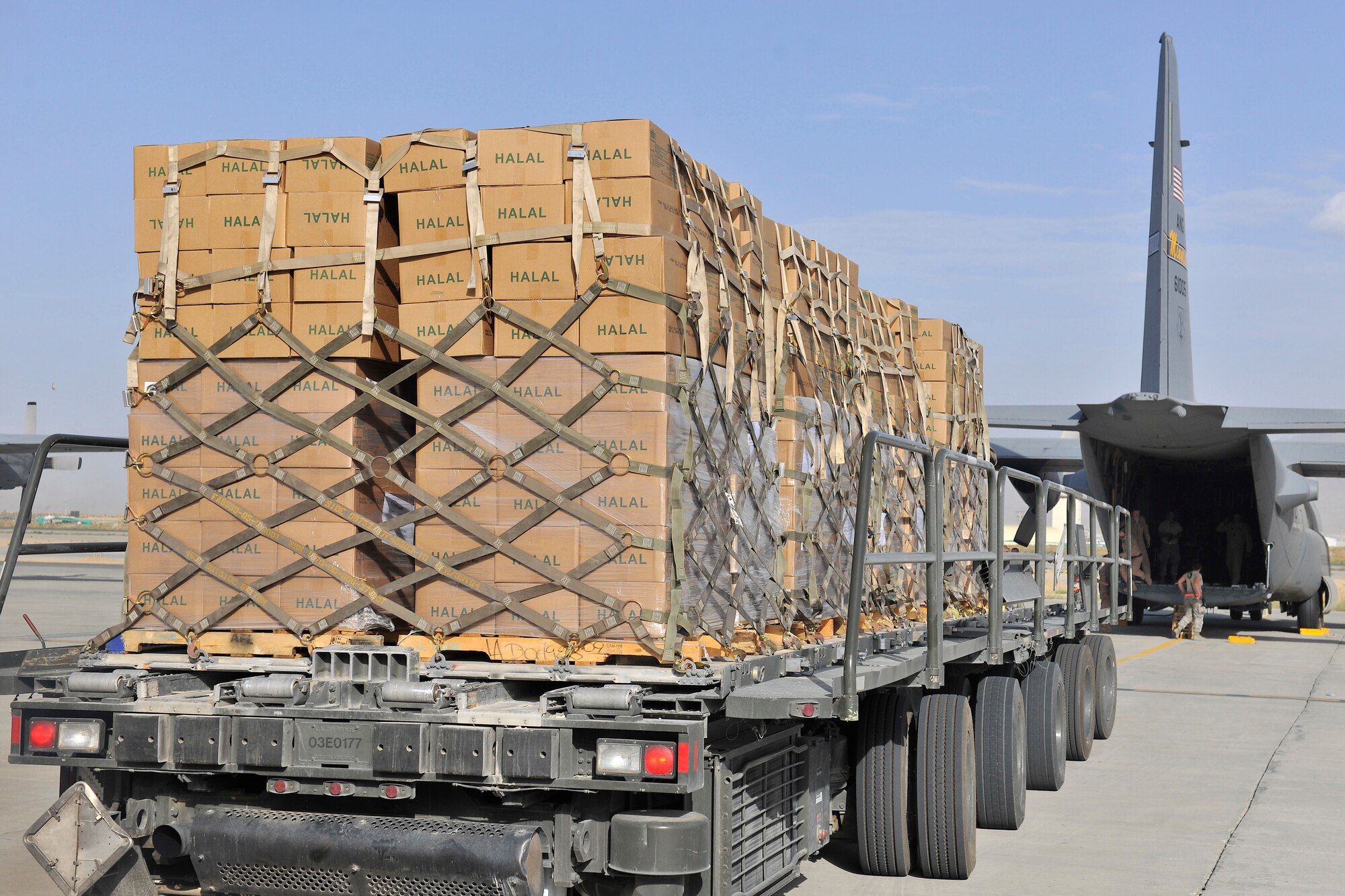 Thousands of Halal meals are ready to be loaded on to a C-130H at Bagram Airfield, Afghanistan, Aug. 1, 2010. The Halal meals will be delivered to Pakistan as part of a humanitarian relief mission flown by the U.S. Air Force.  Monsoon floods brought on by torrential rains have in Pakistan have devastated hundreds of thousands.  (U.S. Air Force photo/Staff Sgt. Christopher Boitz)