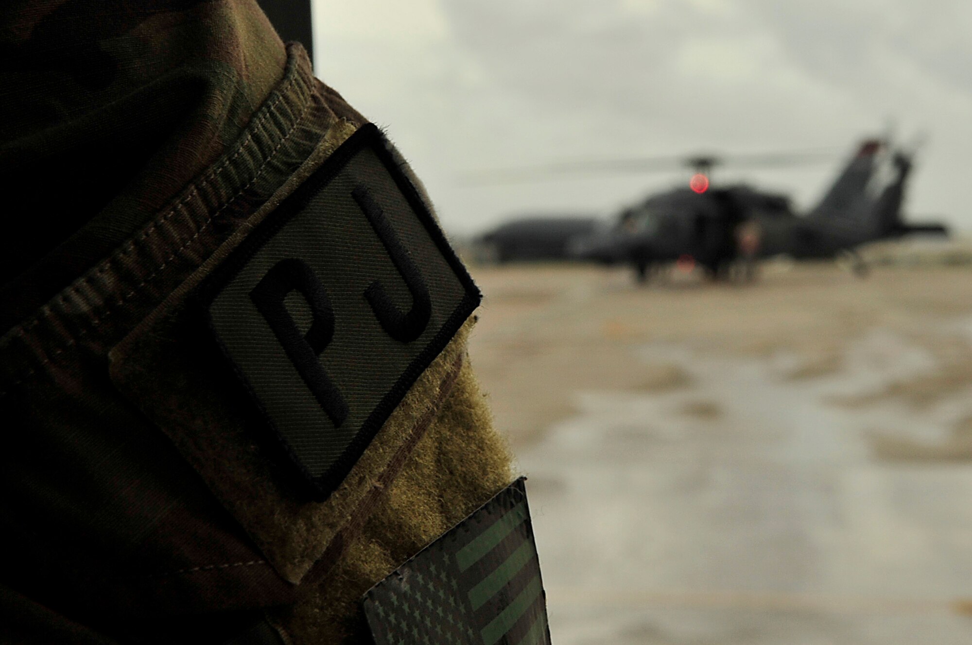 Members from the 31st and 33rd Rescue Squadron participate in a joint training exercise on Camp Hansen July 28. The 31st RQS uses various fixed- and rotary-wing insertion and extraction assets providing combat and humanitarian search, rescue and medical assistance in all environments. The 33rd RQS is a combat-ready HH-60G Pave Hawk squadron whose mission is search, rescue and recovery, night or day, over land or water. (U.S. Air Force photo by Senior Airman Amanda N. Grabiec)