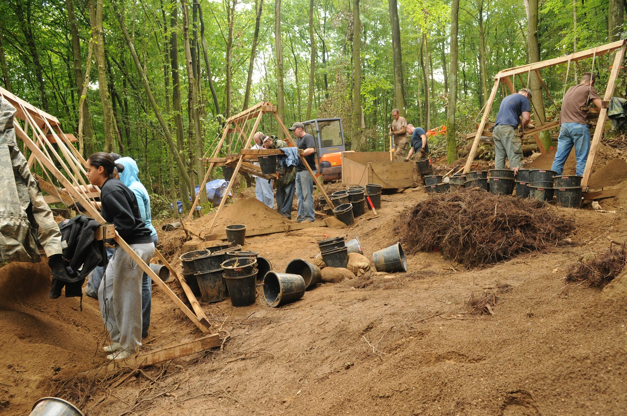 RHEINLAND-PFALZ, Germany – Servicemembers sift through dirt on a local logging trail in search of wreckage from an aircraft downed during World War II during a Joint Prisoners of War/Missing in Action Accounting Command mission July 28. The mission of the JPAC is to achieve the fullest possible accounting of all Americans missing as a result of the nation's past conflicts. (U.S. Air Force photo/Staff Sgt. Benjamin Wilson)