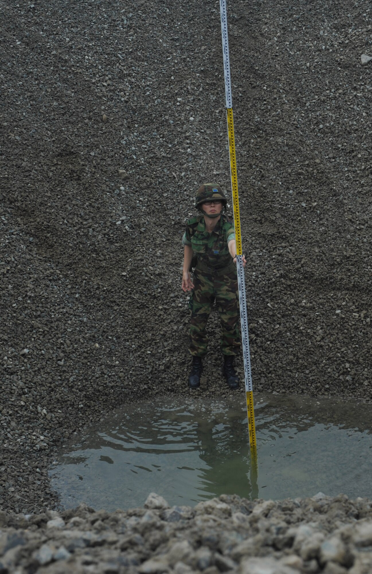 A member of the 91st ACEG,  helps pump water during the 2010 Combined Airfield Repair Exercise July 29 at Jungwon AB.  The purpose of the Exercise is to enhance interoperability, evaluate capabilities, and strengthen combined relationships. (U.S. Air Force Photo/Senior Airman Evelyn Chavez)