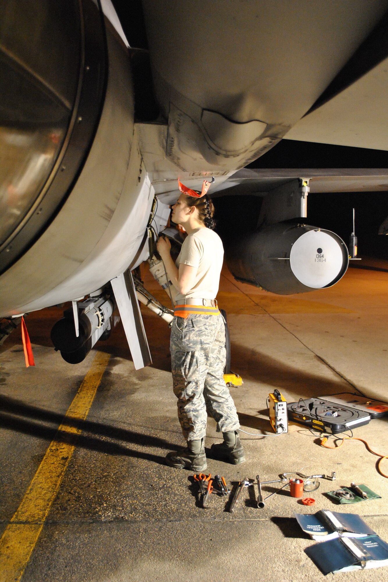 KUNSAN AIR BASE, South Korea -- Airman 1st Class Genevieve Ramsey, 14th Aircraft Maintenance Unit engine specialist, assists with an engine borescope June 26 on the flightline. Airman Ramsey and her unit, along with members of the 14th Fighter Squadron, are deployed to Kunsan Air Base in an effort to maintain regional stability in the Asia-Pacific theater and promote stronger relations with U.S. allies. (courtesy photo by Tech. Sgt. Michael Nelson) 