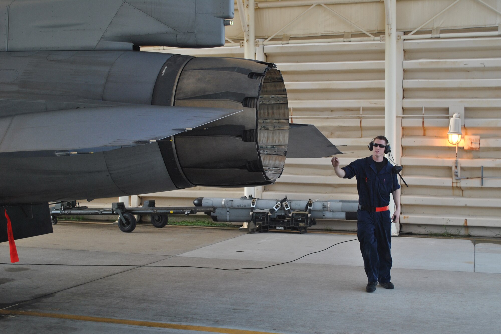KUNSAN AIR BASE, South Korea -- Senior Airman Dennis Martin, 14th Aircraft Maintenance Unit crew chief, completes final checks before launching an F-16 Fighting Falcon June 15 on the flightline. Airman Martin and his unit, along with members of the 14th Fighter Squadron, have been deployed to Kunsan Air Base since early May. (courtesy photo by Tech. Sgt. Michael Nelson)