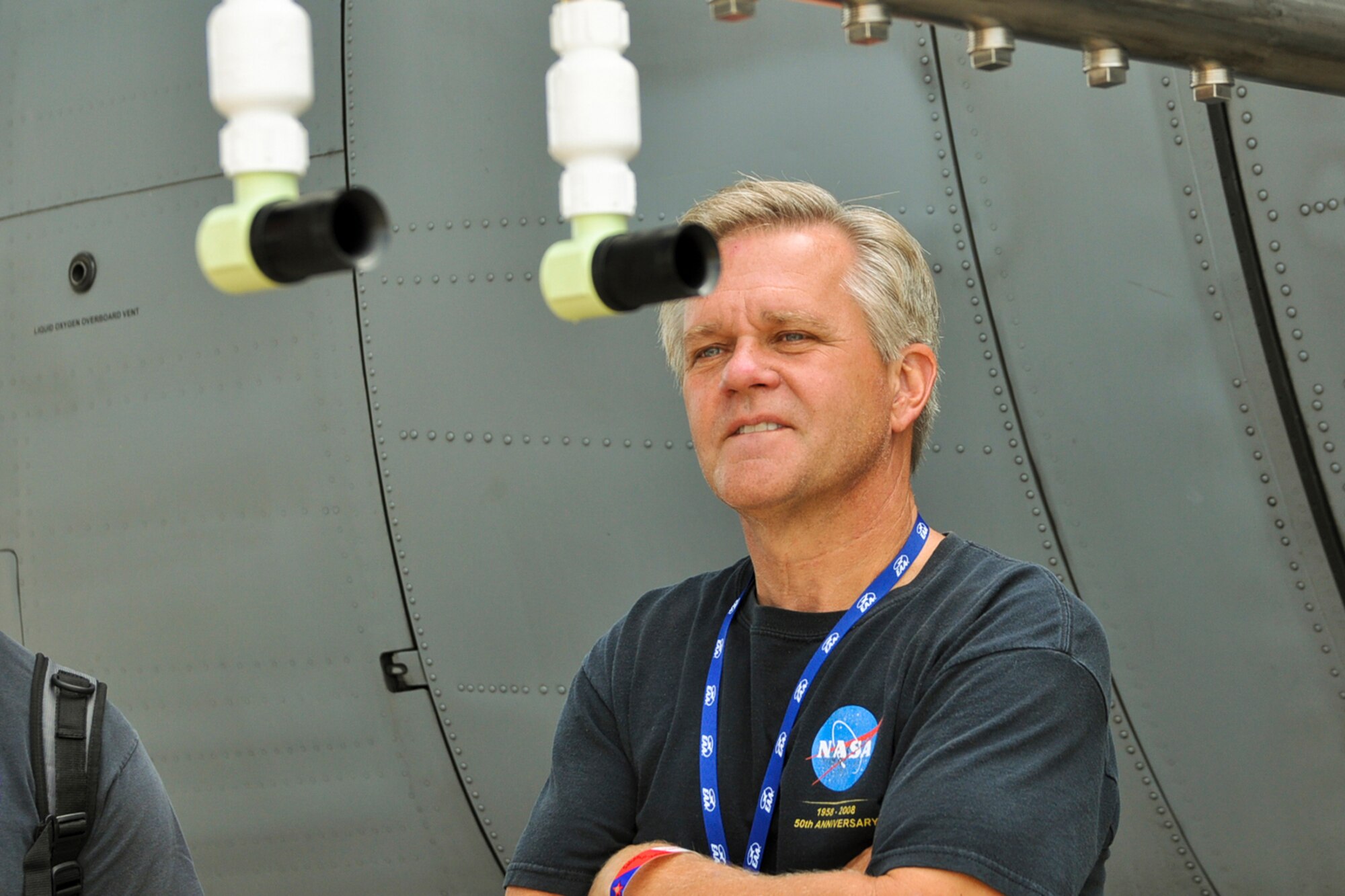 OSHKOSH, Wis. -- A AirVenture 2010 air show spectator examines a U.S. Air Force specially-equipped aerial spray C-130H aircraft from the 910th Airift Wing based at Youngstown Air Reserve Station, Ohio, while it is on display at Wittman Regional Airport here, July 30, 2010. This aircraft and approximately 14 YARS Airmen were invited to particpate in this air show because of their recent involvement in the Gulf oil spill relief efforts. The 910th AW is home to the Department of Defense's only large area fixed-wing aerial spray mission. U.S. Air Force photo by Senior Airman Brenda Haines    
