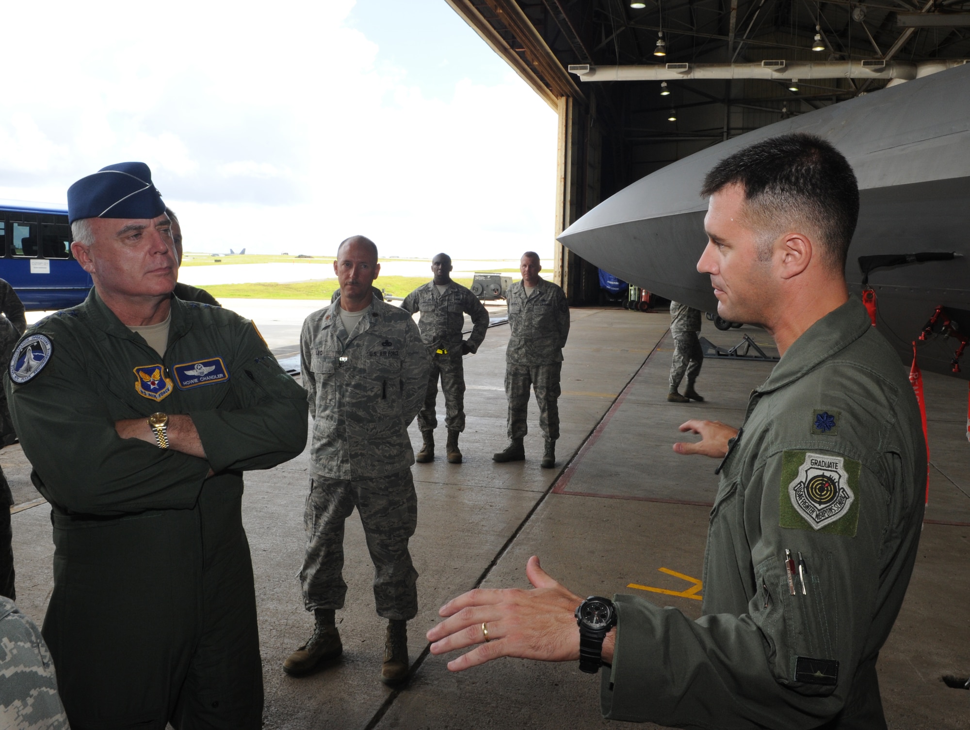 ANDERSEN AIR FORCE BASE, Guam - Lt. Col. Peter Fesler, 27th Expeditionary Fighter Squadron commander, discusses F-22 Raptor operations at Andersen Air Force Base, Guam, with Air Force Vice Chief of Staff Gen. Carrol ?Howie? Chandler on Aug. 3, 2010.  General Chandler stopped at Andersen while traveling through the Pacific region.  He was accompanied on his visit by Pacific Air Forces Vice Commander Maj. Gen. Douglas Owens, a former 36th Wing commander. (U.S. Air Force photo/Tech. Sgt. Mike Andriacco)