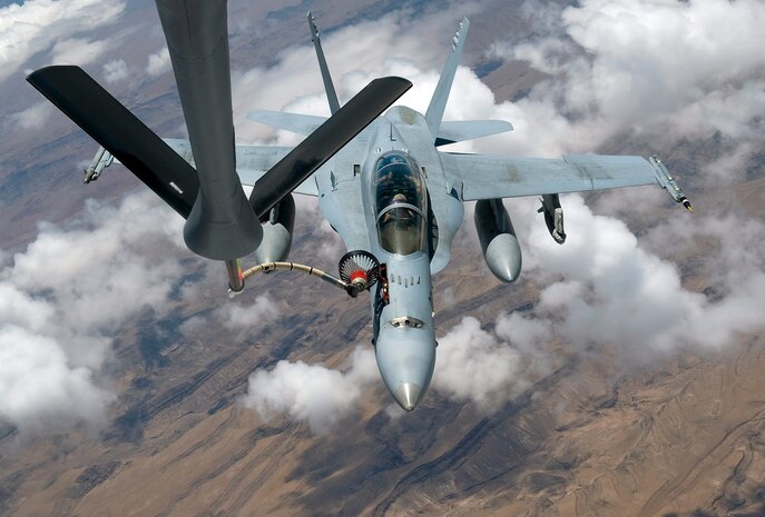 NELLIS AIR FORCE BASE, Nev. -- A F-18 Hornet assigned to the Marine Attack Squadron 225, Marine Corps Air Station Miramar, Calif., refuels from a KC-135 Stratotanker assigned to the 22nd Air Refueling Wing, McConnell Air Force Base, Kan., over the Nevada Test and Training Range, Nev., July 29, 2010 during Red Flag 10-4. (U.S. Air Force Photo by Airman 1st Class Brett Clashman)
