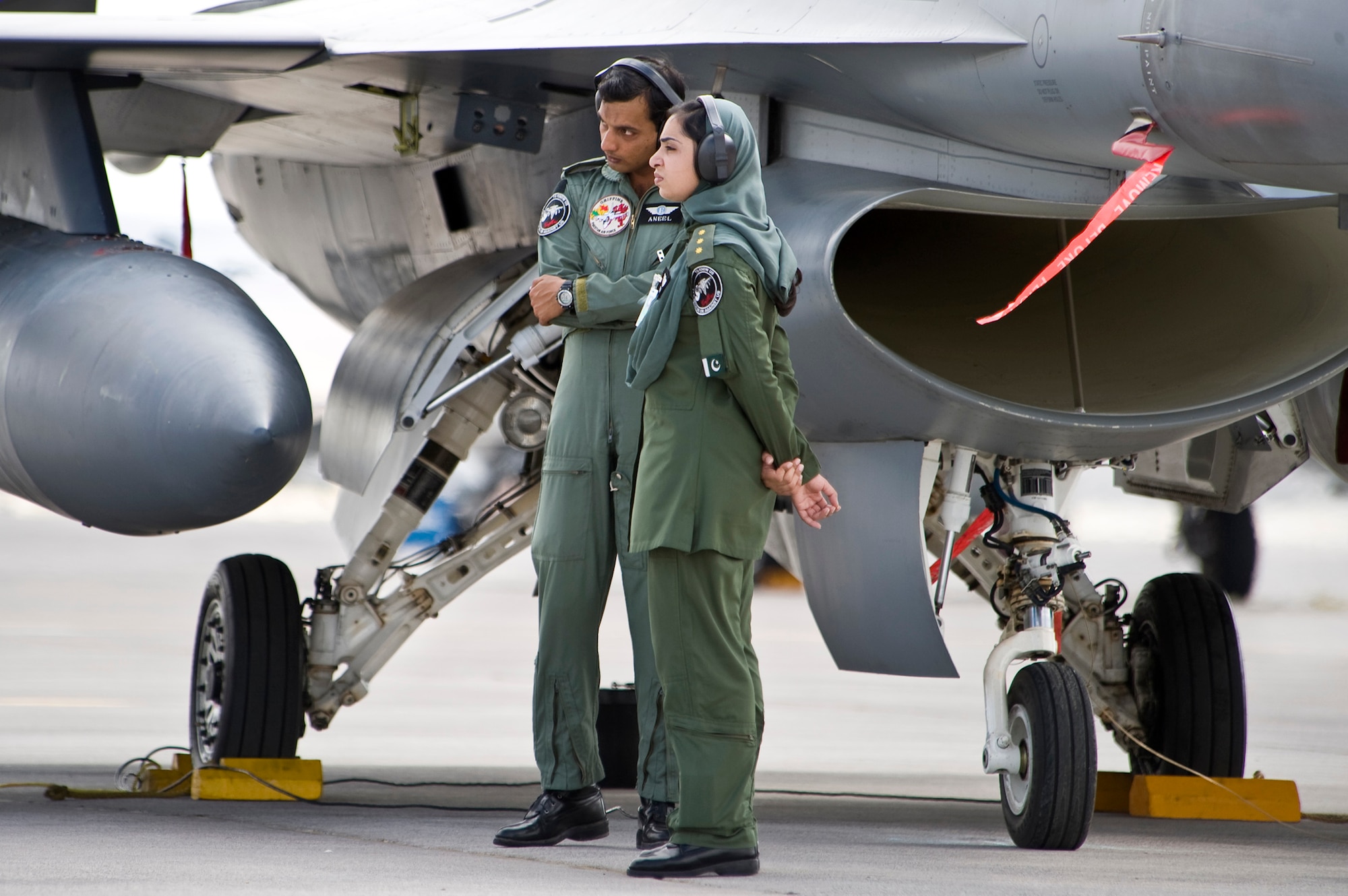 NELLIS AIR FORCE BASE, Nev. -- Maintenance officers from the Pakistan Air Force oversee an early morning launch of their F-16s during Red Flag 10-4 at Nellis on July 26, 2010.  The U.S. Air Force is hosting approximately 100 Pakistan Air Force pilots and support personnel at the world's premier large force employment and integration exercise July 17-31 at Nellis Air Force Base, Nev. This is the PAF's first time participating in the Red Flag exercise. (U.S. Air Force photo/Lawrence Crespo) 



