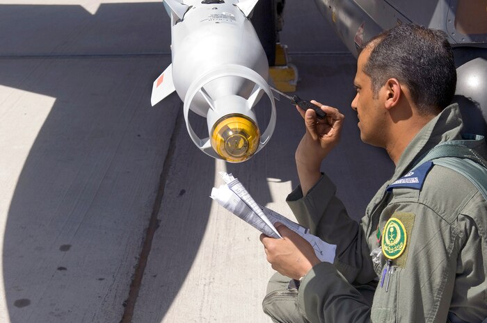 NELLIS AIR FORCE BASE, Nev. -- A pilot from the Royal Saudi Air Force pre-flights an F-15S on July 23, 2010 at Nellis Air Force Base, Nev., during Red Flag 10-4. Red Flag is a realistic combat training exercise involving the air forces of the United States and its allies. The exercise is hosted north of Las Vegas on the Nevada Test and Training Range.  In addition to U.S. aircraft, the Royal Saudi, Pakistan and Republic of Singapore Air Forces will be participating and NATO is providing additional E-3 support. (U.S. Air Force Photo by Airman 1st Class Brett Clashman)
