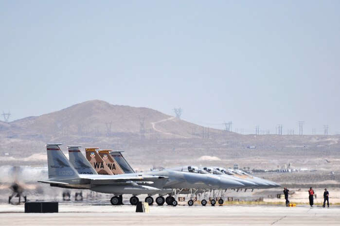 NELLIS AIR FORCE BASE, Nev. -- Crew chiefs from the 123d Fighter Squadron, Portland Air National Guard perform an end-of-runway check prior to their F-15's depart Nellis to participate in Red Flag, July 21, 2010.  Red Flag is a realistic combat training exercise involving the air forces of the United States and its allies. The exercise is conducted on the 15,000-square-mile NTTR, north of Las Vegas. (U.S. Air Force photo/Capt. Ashley Norris) 



