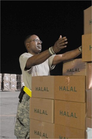 Army Sgt. John Lightfoot builds a pallet of halal meals Aug. 2, 2010, at Bagram Airfield, Afghanistan, for airlift into northwest Pakistan. These meals are some of the 345 thousand that have been delivered since July 31, 2010, as part of the humanitarian flood relief assistance provided to the area that's been hit by monsoon rains in recent days. Sergeant Lightfoot is a member of the 82nd Sustainment Brigade. (U.S. Air Force photo/Capt. Chris Sukach)