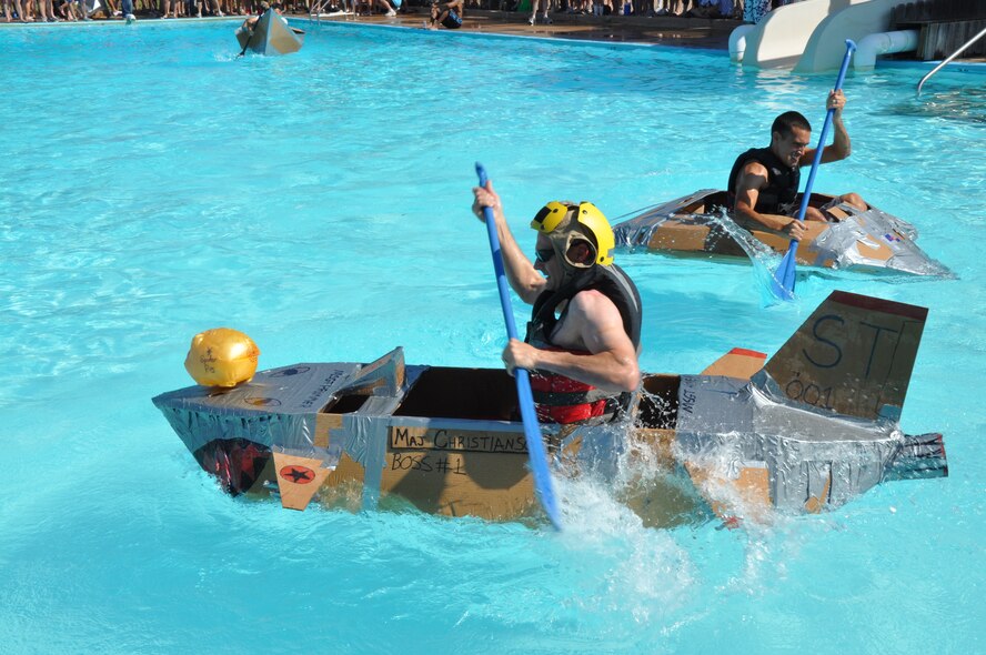 The captain of the Spider Pigs’ vessel is the first to make it to the end of the Bunker Hill Pool and begin paddling back to finish during the 10th annual Build-a-Boat Race at Sheppard Air Force Base, Texas, July 31. The Spider Pigs won the Commander’s Choice category. (U.S. Air Force photo/Airman 1st Class Adawn Kelsey)