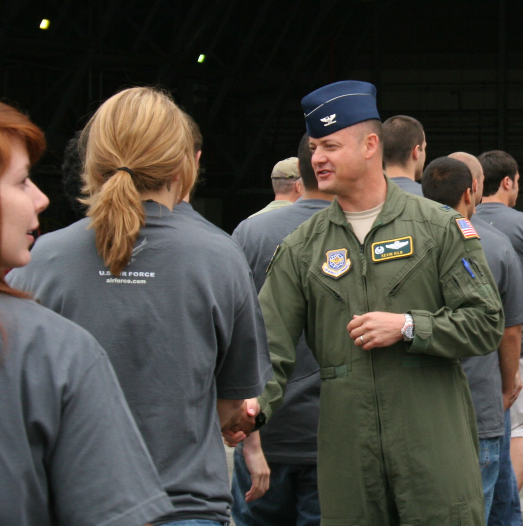 Col. Kevin Kilb, commander of the 62nd Airlift Wing at Joint Base Lewis McChord, Wash., congratulates one of more than 200 future Airmen after a Delayed Enlistment Program (DEP) ceremony at the McChord Air Expo July 14. According to officials from the 361st Recruiting Squadron, the number of participants (201) was an Air Force record. (U.S. Air Force photo/Christine Lang)