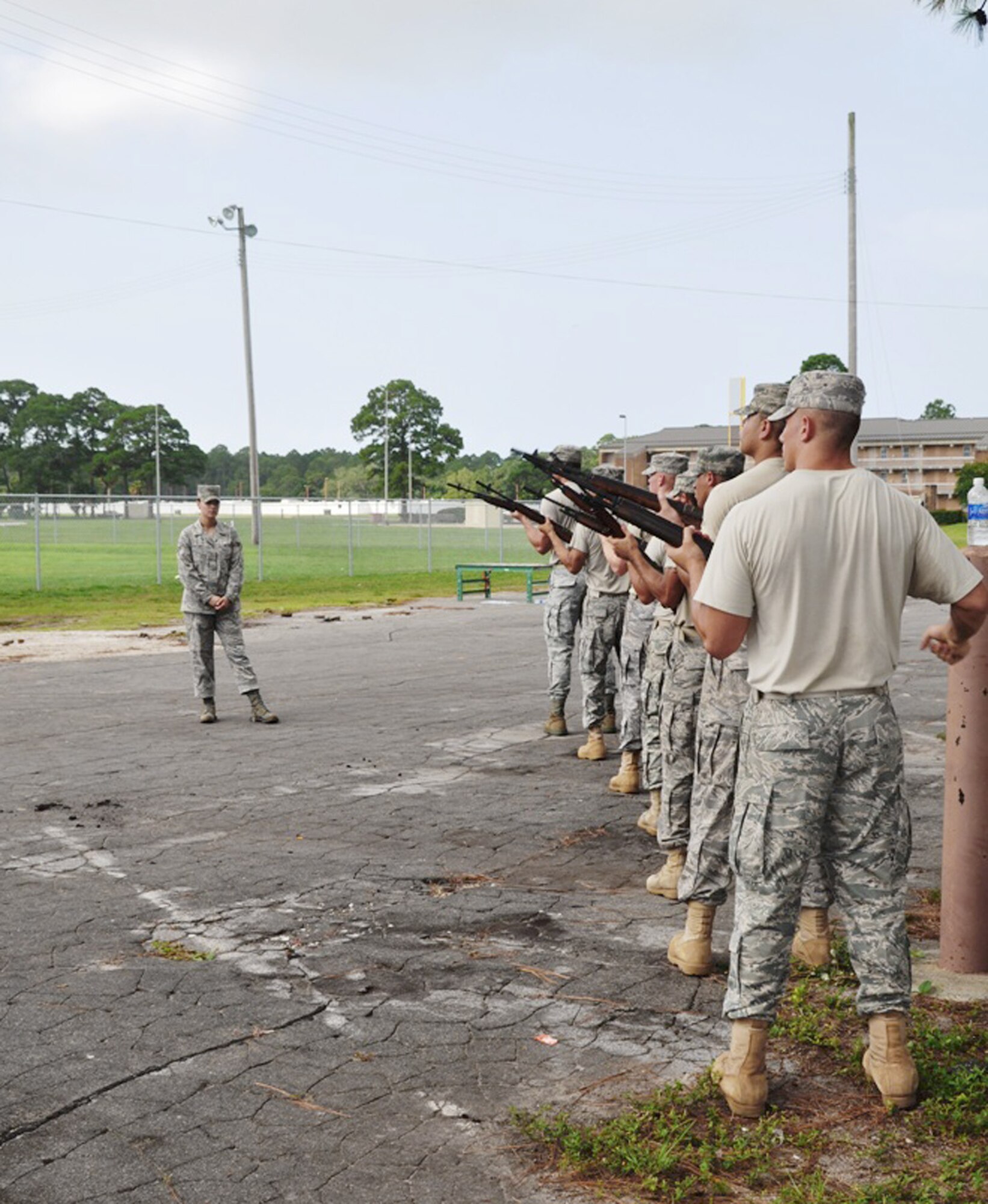 Tyndall Air Force Base Honor guard Airmen practice the gun salute for active-duty funeral ceremonies with Senior Airman Krystie Martinez. Airmen participated in a week-long training course to improve their skill and give them the ability to teach others. Airman Martinez is a visiting U.S. Air Force Honor Guard instructor. (U.S. Air Force photo/Senior Airman Veronica McMahon)