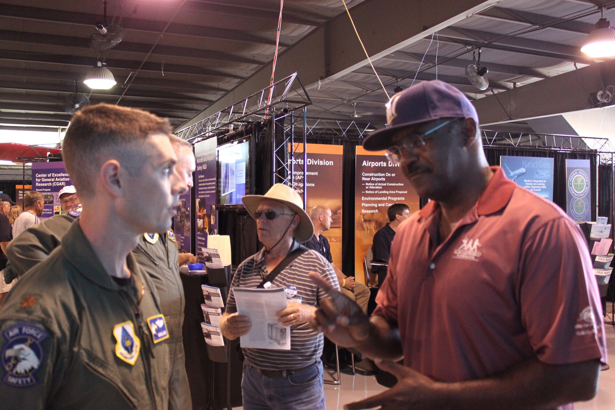 Former major league baseball player Larry Hisle discusses Air Force remotely piloted aircraft operations and capabilities with Maj. Mike Conte, an MQ-1 Predator and MQ-9 Reaper pilot, July 29, 2010, during the Experimental Aircraft Association's Airventure 2010 general aviation air show at Oshkosh, Wis.  Major Conte is assigned to the Air Force Safety Center at Kirtland Air Force Base, N.M.  (U.S. Air Force photo/Capt. Al Bosco)