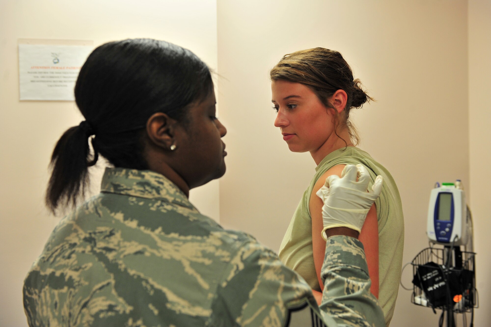 100803-F-8430J-032
SHAW AIR FORCE BASE, S.C. -- Master Sgt. Tracy Sankey (left), 20th Medical Operations Squadron immunization technician, sterilizes the arm of Airman 1st Class Victoria Secrist, 20th Fighter Wing Public Affairs, in preparations for an immunization August 3, 2010. The month of August is National Immunization Awareness Month, which prepares and informs people for the upcoming cold and flu season. Routine immunizations are important in saving lives since they prevent common diseases. (U.S. Air Force photo/Airman 1st Class Amber E. Jacobs)
