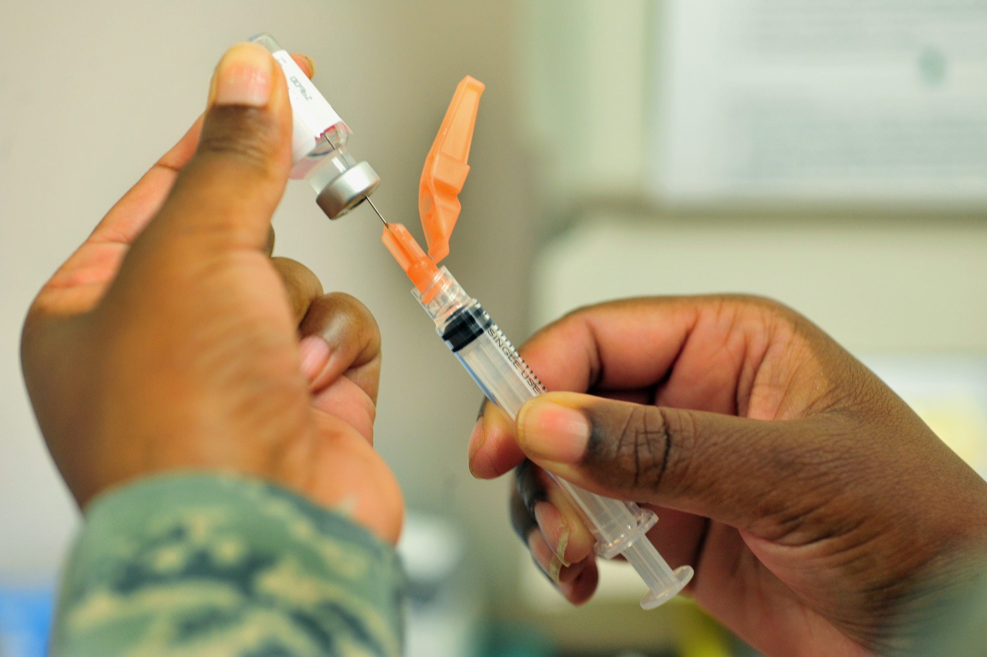100803-F-8430J-023
SHAW AIR FORCE BASE, S.C. -- Master Sgt. Tracy Sankey, 20th Medical Operations Squadron immunization technician, fills a syringe before administering an immunization August 3, 2010. The month of August is National Immunization Awareness Month, which prepares and informs people for the upcoming cold and flu season. Routine immunizations are important in saving lives since they prevent common diseases. (U.S. Air Force photo/Airman 1st Class Amber E. Jacobs)