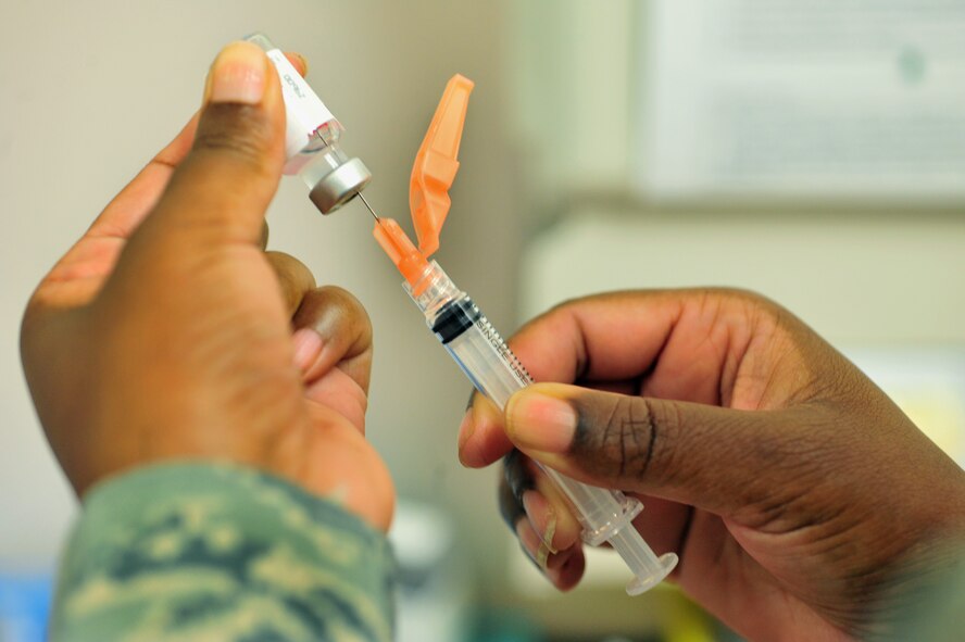 100803-F-8430J-023SHAW AIR FORCE BASE, S.C. -- Master Sgt. Tracy Sankey, 20th Medical Operations Squadron immunization technician, fills a syringe before administering an immunization August 3, 2010. The month of August is National Immunization Awareness Month, which prepares and informs people for the upcoming cold and flu season. Routine immunizations are important in saving lives since they prevent common diseases. (U.S. Air Force photo/Airman 1st Class Amber E. Jacobs)