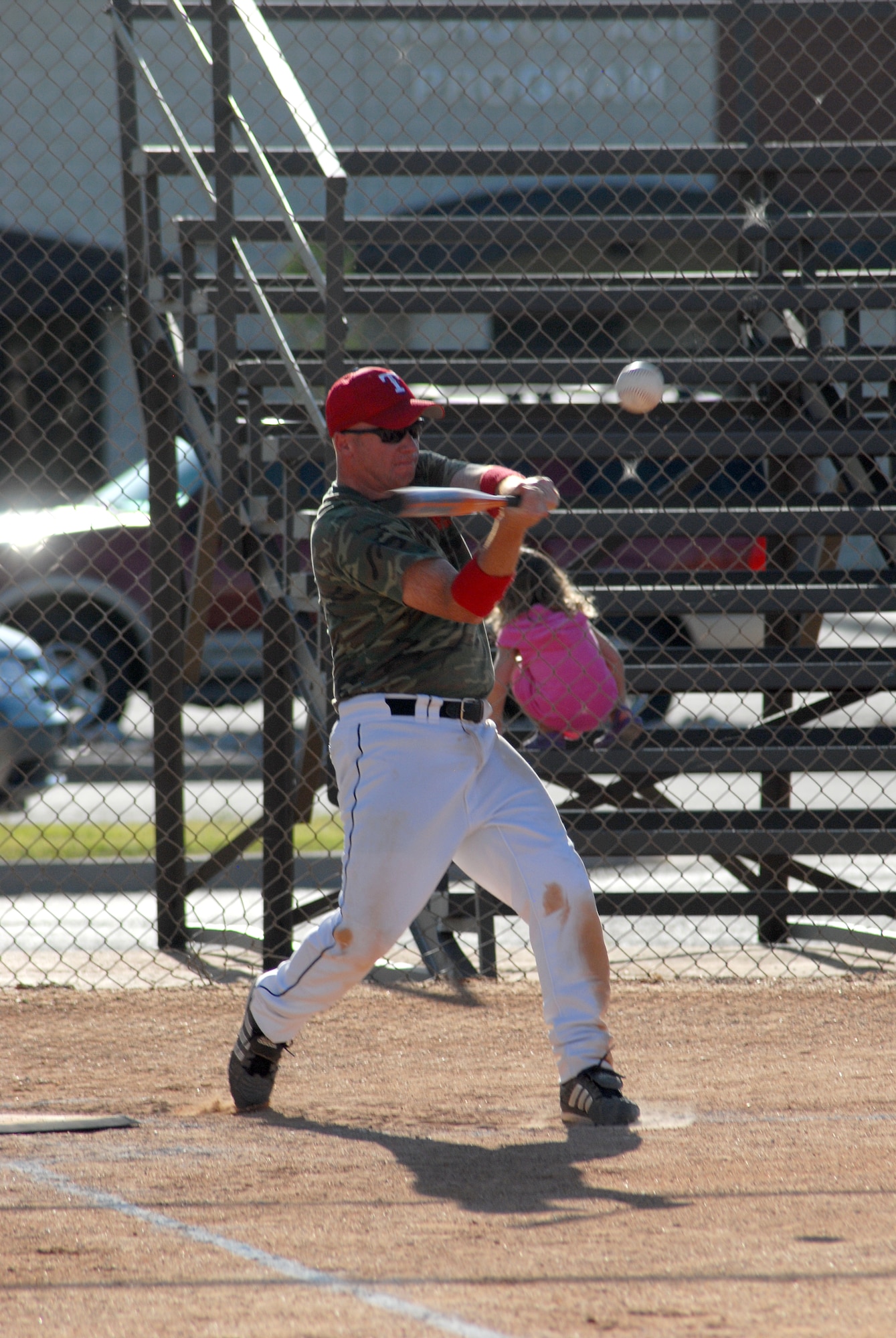 Staff Sgt Kevin Graham, player coach for the 312th Training Squadron softball team, takes a cut at the ball during an elimination game against the 344th Military Intelligence Battalion softball team.  The 312th went on to knock the Army out the base intramural softball tournament by beating them 14 -7. (U.S. Air Force photo/Master Sgt Randy Mallard)