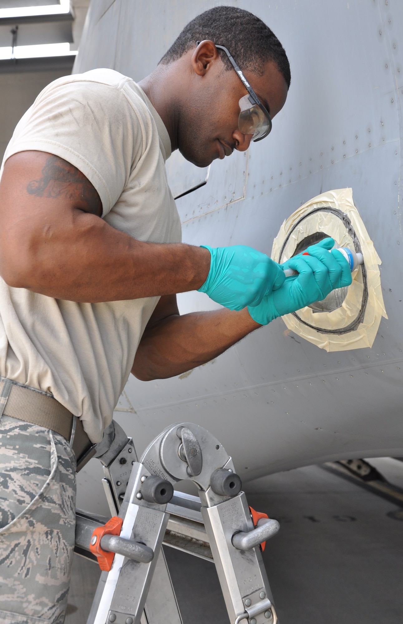 Senior Airman Steven A. Brown seals a taxi light on a C-17 Globemaster III Aug. 3, 2010, at Charleston Air Force Base, S.C. Airman Brown is a crew chief with the 315th Aircraft Maintenance Squadron here. (U.S. Air Force photo/Staff Sgt. Shane Ellis)
