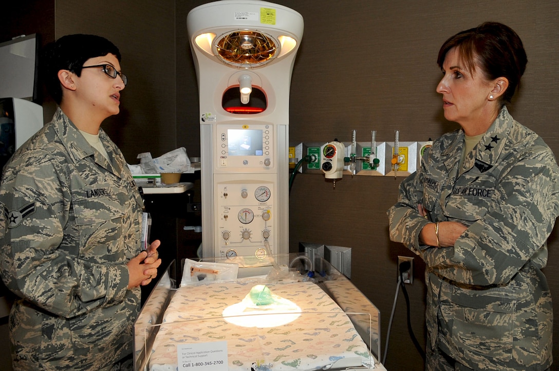 LANGLEY AIR FORCE BASE, Va -- Airman 1st Class Crystal Landers, 633d Medical Group medical technician, (left) explains the operations of the Panda Warmer, a new high tech warming bed for newborns, to Maj. Gen. Kimberly A. Siniscalchi, assistant Air Force surgeon general, during her tour of the new Langley hospital Aug. 3. Maj. Gen. Siniscalchi visited the hospital to interact with the staff to ensure medical care development for nursing needs are met. (U.S. Air Force photo/Staff Sgt. Ashley Hawkins)(RELEASED)