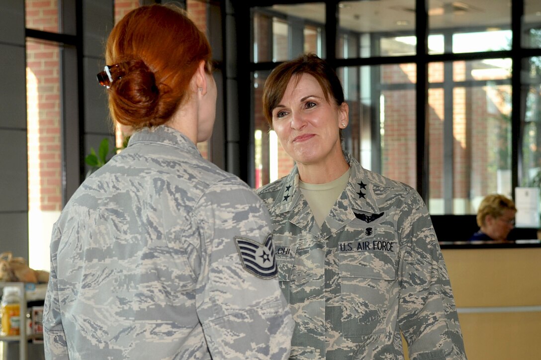 LANGLEY AIR FORCE BASE, Va -- Maj. Gen. Kimberly A. Siniscalchi, assistant Air Force surgeon general, converses with Tech Sgt. Erine Gallant, 633d Medical Group family health clinic flight chief, on the duties of her job during her tour of the new Langley hospital Aug. 3. Maj. Gen. Siniscalchi visited Langley to meet with the key medical leaders to discuss nursing and force development. (U.S. Air Force photo/Staff Sgt. Ashley Hawkins)(RELEASED)