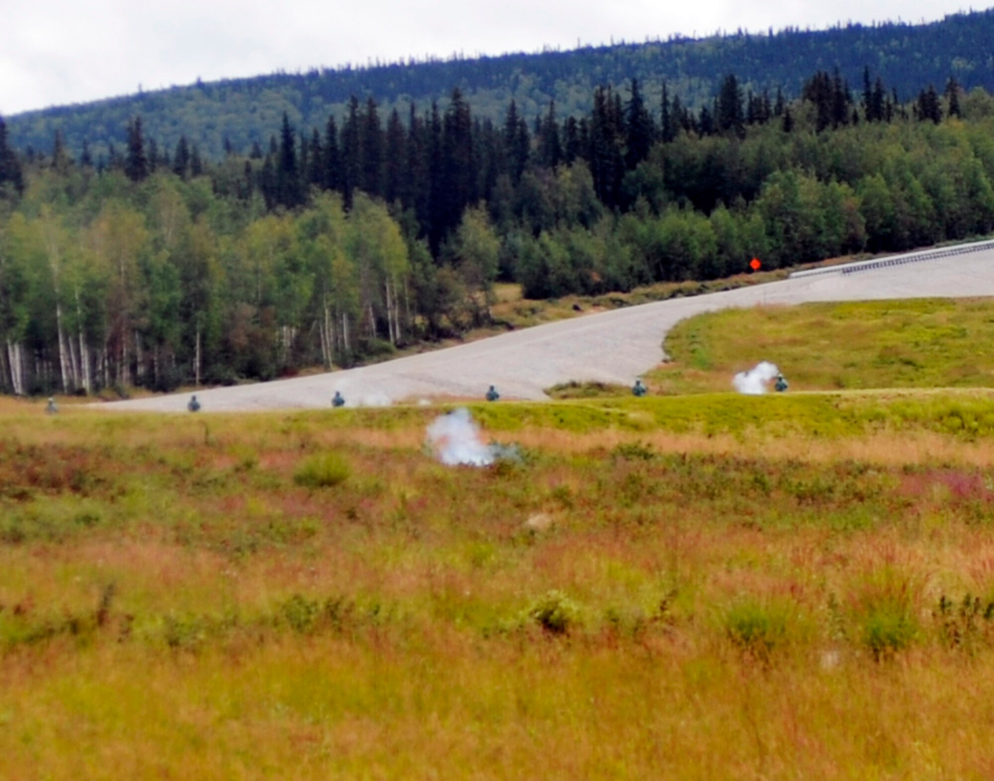 Smoke rises from the impact of 40 mm dummy grenades during a training operation July 28, 2010, Joint Pacific Alaska Range Complex, Alaska. Training was conducted to hone Soldiers combat team skills. The teams face infantry and mechanized targets both stationary and mobile. The 1st Brigade, 25th Infantry Division is located at Fort Wainwright, Alaska . (U.S. Air Force photo/Airman 1st Class Willard E. Grande II)