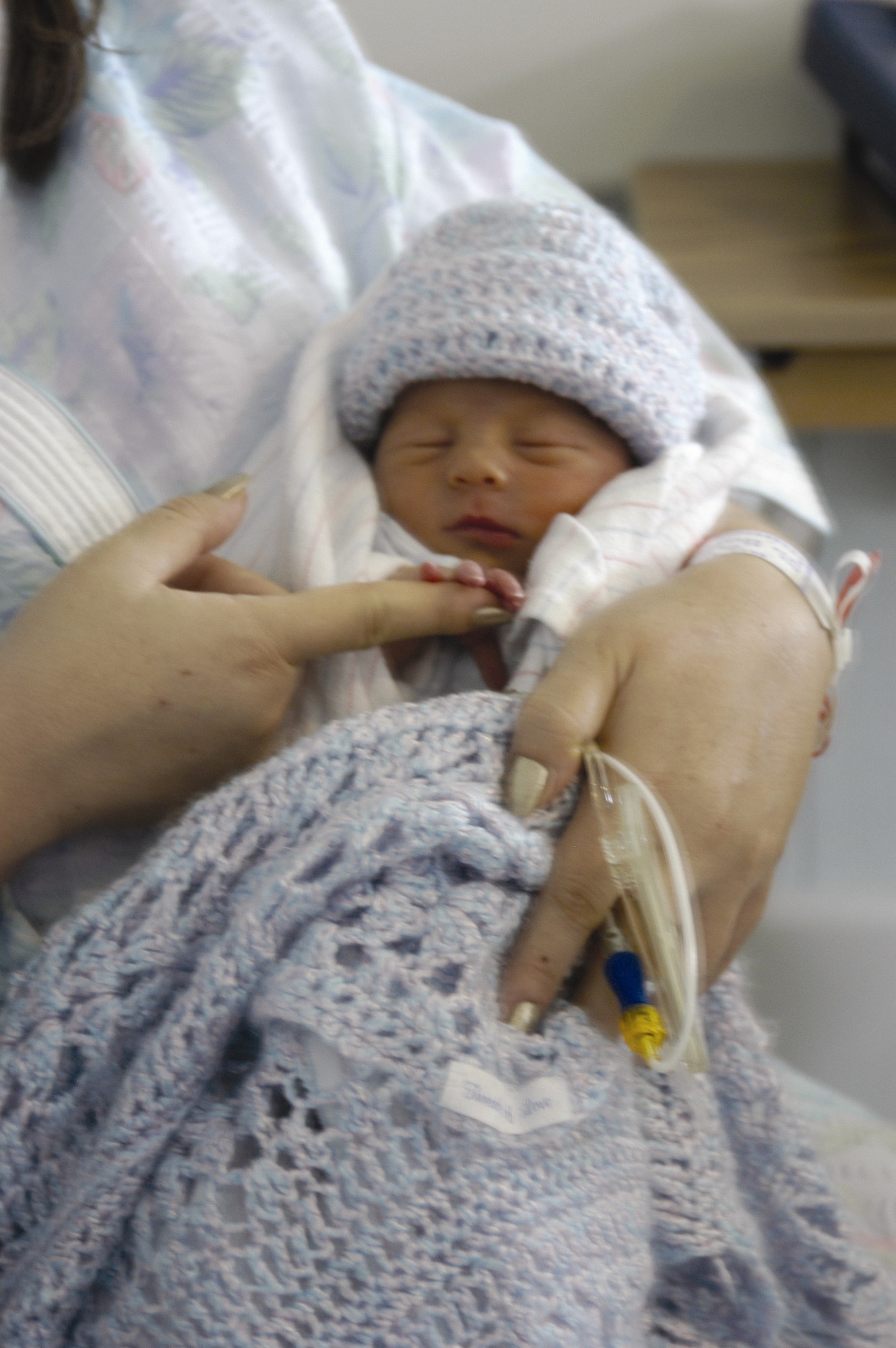 A mother holds her baby at Wilford Hall Medical Center, San Antonio, Texas, which has been named a "Baby-Friendly Hospital" through the Texas Department of State Health Services' Texas Ten Step Facility Program. (U.S. Air Force courtesy photo)