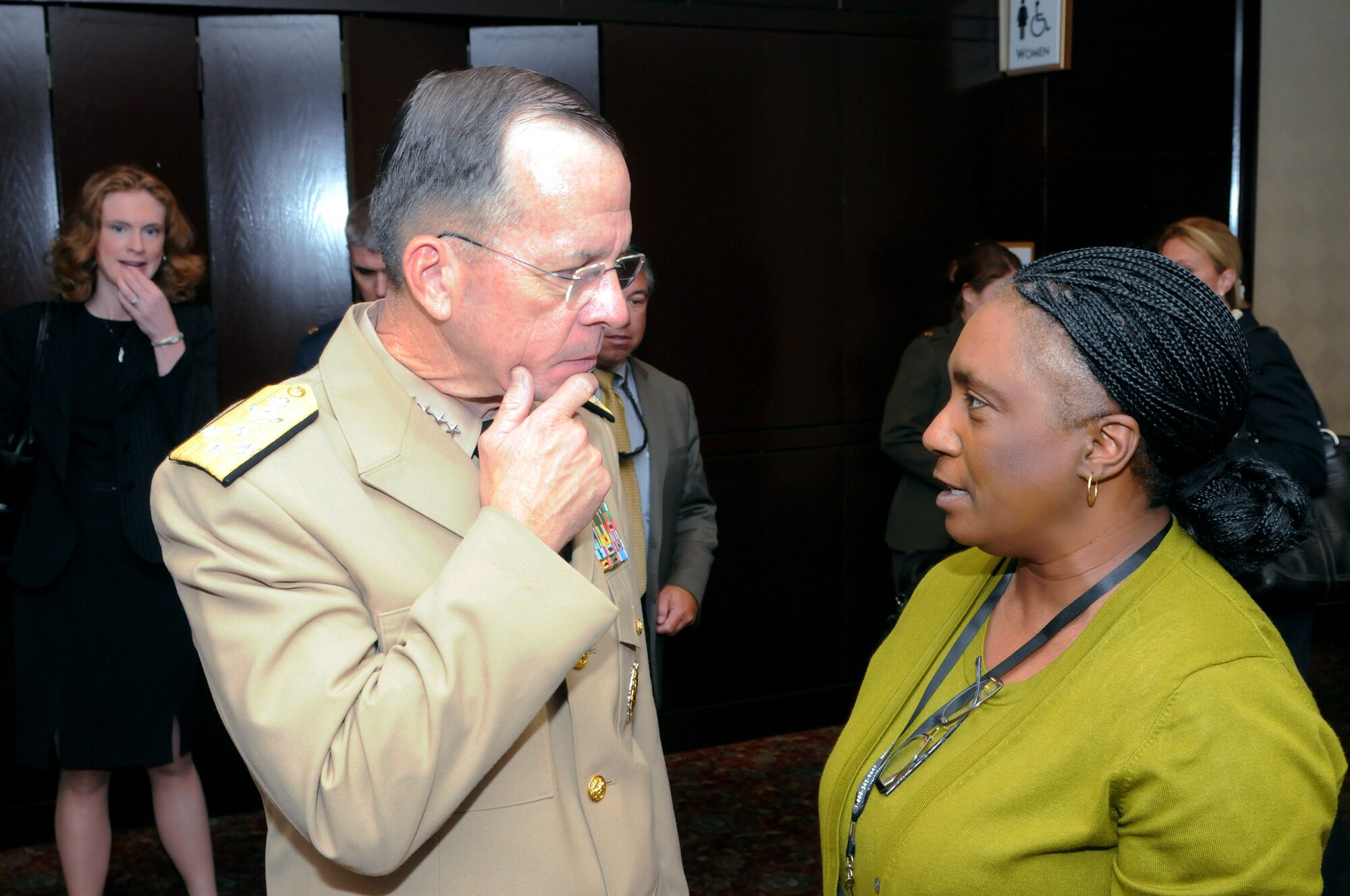 Adm. Mike Mullen, the chairman of the Joint Chiefs of Staff, talks with Elaine Wright, who volunteers with the Maryland National Guard's family programs.  Admiral Mullen was a speaker at the 2010 National Guard Family Program Volunteer Workshop in New Orleans, La., on Aug. 2, 2010. (U.S. Army photo by Staff Sgt. Jim Greenhill) (Released)