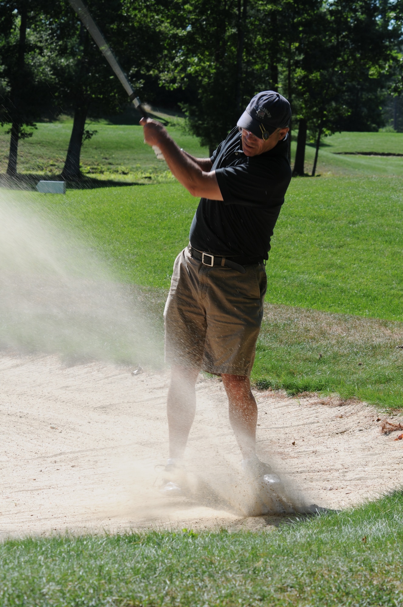 NH Air National Guard Master Sergenat Robert Mills hits his golf ball out of the bunker during the 46th Annual NH National Guard Golf Classic 2010 tournament held at The Oaks golf link, Somersworth, NH, July 26, 2010.(released/photo by Aaron P. Vezeau)