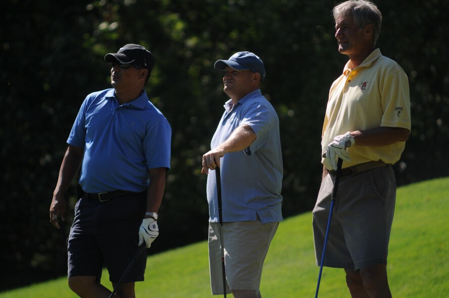 NH Air National Guard Master Sergeant Gil Fradillada (left), Chief Master Sergeant Gregg Fournier, and Senior Master Sergeant (retired) Robert Hamilton watch fellow golfers tee off during the 46th Annual NH National Guard Golf Classic 2010 tournament held at The Oaks golf link, Somersworth, NH, July 26, 2010.(released/photo by Aaron P. Vezeau)