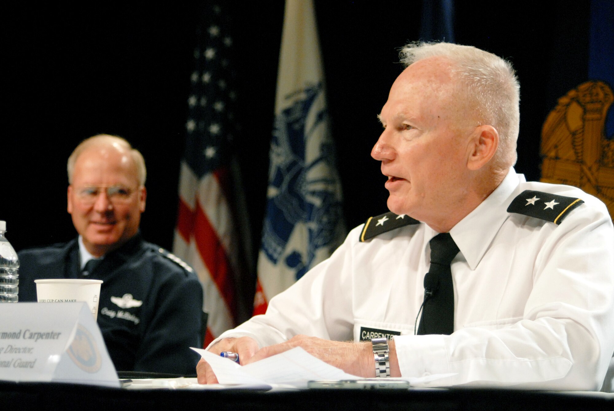 Army Maj. Gen. Raymond Carpenter (right), the acting director of the Army National Guard, and Air Force Gen. Craig R. McKinley, the chief of the National Guard Bureau, along with other Guard leaders answered questions from the audience Aug. 2, 2010, during a panel discussion at the 2010 National Guard Volunteer Workshop in New Orleans.  More than 1,000 Guard volunteers from the 54 states and territories attended the conference. (U.S. Army photo by Sgt. Darron Salzer)