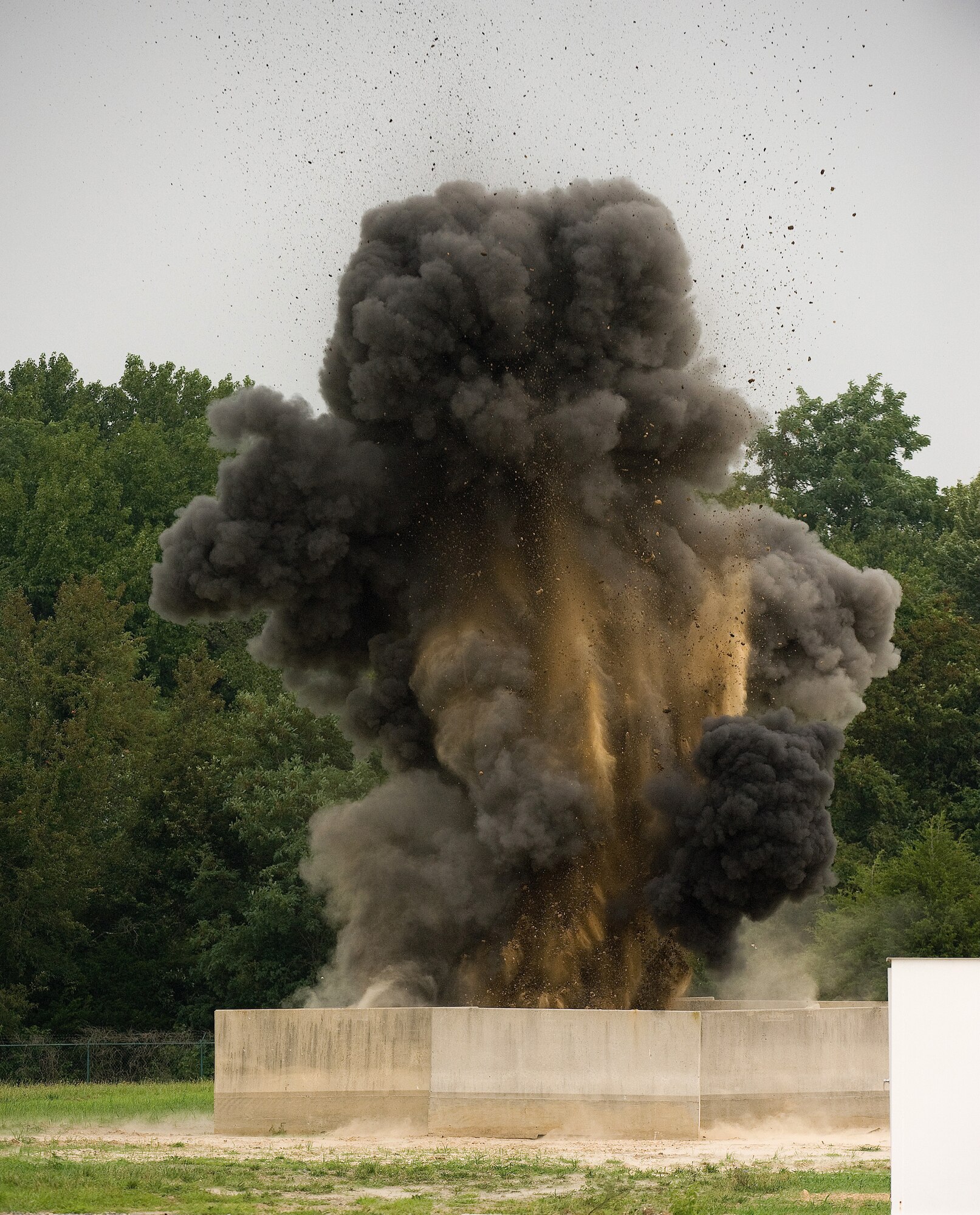 A piece of ordnance detonates at the Explosive Ordnance Disposal range at Dover Air Force Base, Del., July 29. EOD technicians from the 512th Civil Engineer Squadron here were testing various detonation theories as part of their core training. (U.S. Air Force photo/Jason Minto)