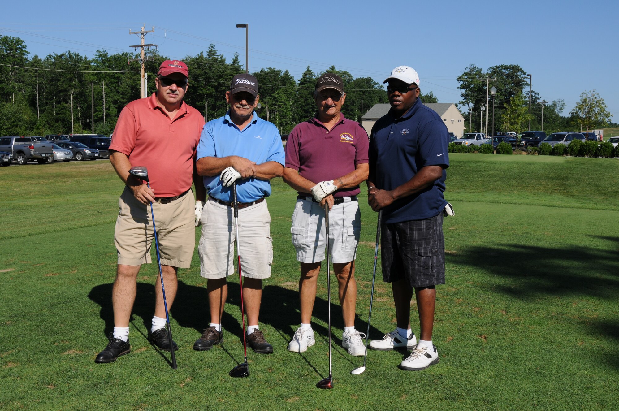 NH Air National Guard members (left) Senior Master Sergeant Wade Krause, Master Sergeant William Gammon, Master Sergeant (retired) Earl Andrews, and civilian Tony Tillman pose for a group photo prior to teeing off during the 46th Annual NH National Guard Golf Classic 2010 tournament held at The Oaks golf link, Somersworth, NH, July 26, 2010.(released/photo by Aaron P. Vezeau)