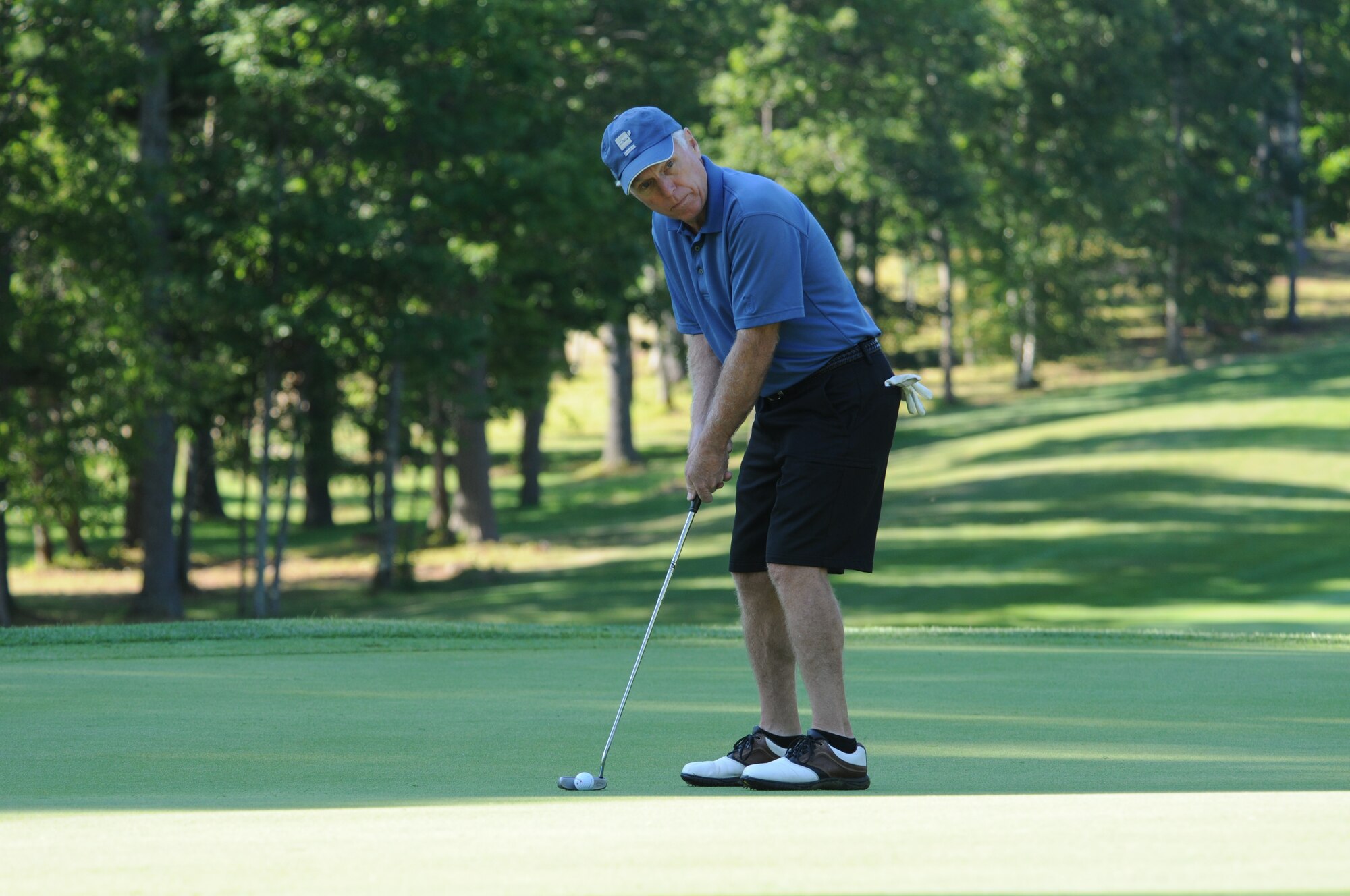 NH Air National Guard Colonel (retired) Thomas Bunting lines up to putt during the 46th Annual NH National Guard Golf Classic 2010 tournament held at The Oaks Golf Links, Somersworth, NH, July 26, 2010. (released/photo by Aaron Vezeau)
