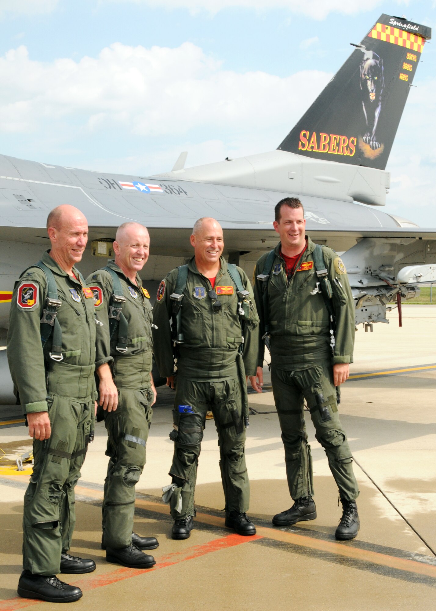 Col. Harry M. “Mike” Roberts, Lt. Col John Thompson, Col. Craig Wallace, Lt. Col Nathan Thomas pose in front of a F-16 after their final flight at Sprinfield Air National Guard Base on July 30, 2010.  The four pilots took their final flights before the planes leave the base. (U.S. Air Force photo by Tech. Sgt. Seth Skidmore/Released) 