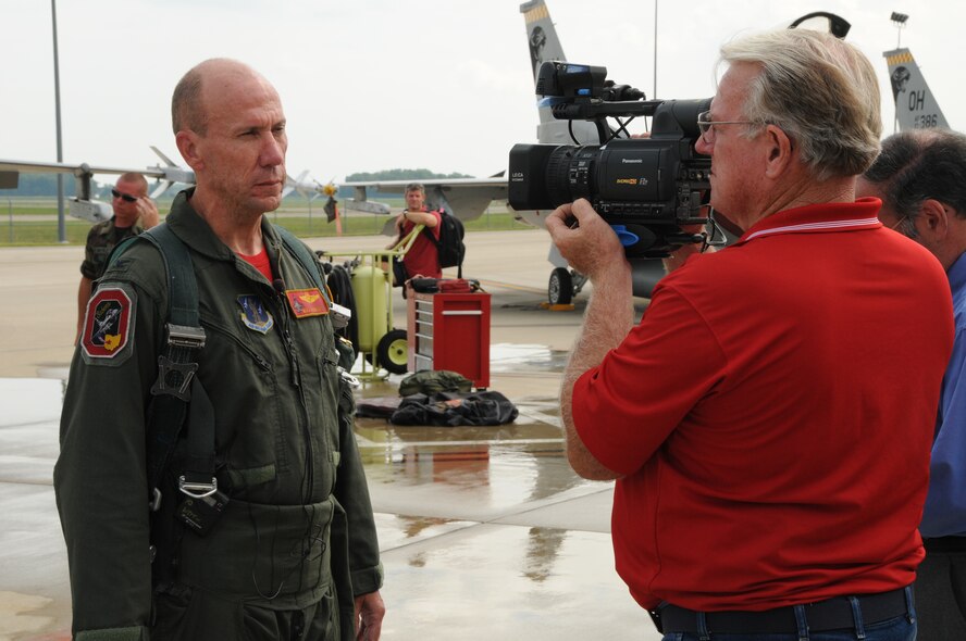Colonel Harry “Mike” Roberts answer questions for local ABC affiliate Channel 2 at Springfield Air National Guard Base on July 30, 2010.  Channel 2 interviewed Col. Roberts on the occasion of the 178th fighter wing final flight of F-16s before the jets leave the base.  (U.S. Air Force photograph by Tech. Sgt. Seth Skidmore/Released)
