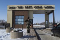 MINOT AIR FORCE BASE, N.D. -- Pictured here is the Minot AFB Main Gate with a security forces gate guard saluting incoming traffick Sept. 5, 2002. (U.S. Air Force photo)