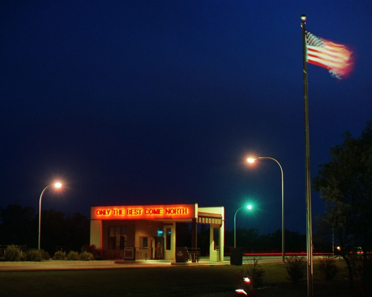 MINOT AIR FORCE BASE, N.D. -- Pictured here is the Minot AFB Main Gate during a night photo shoot Nov. 22, 2000. (U.S. Air Force photo)
