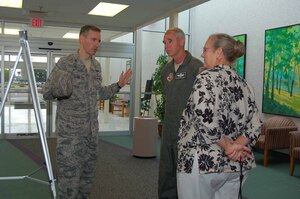 LANGLEY AIR FORCE BASE, Va.—Colonel Eric B. Stone, 633d Medical Group commander, discusses recent and planned hospital renovations with 9th Air Force commander Maj. Gen. William L. Holland and his wife July 30.  Gen. and Mrs. Holland toured the hospital during a three-day visit to Joint Base Langley-Eustis .  (U.S. Air Force Photo/Master Sgt. Anna Hayman)