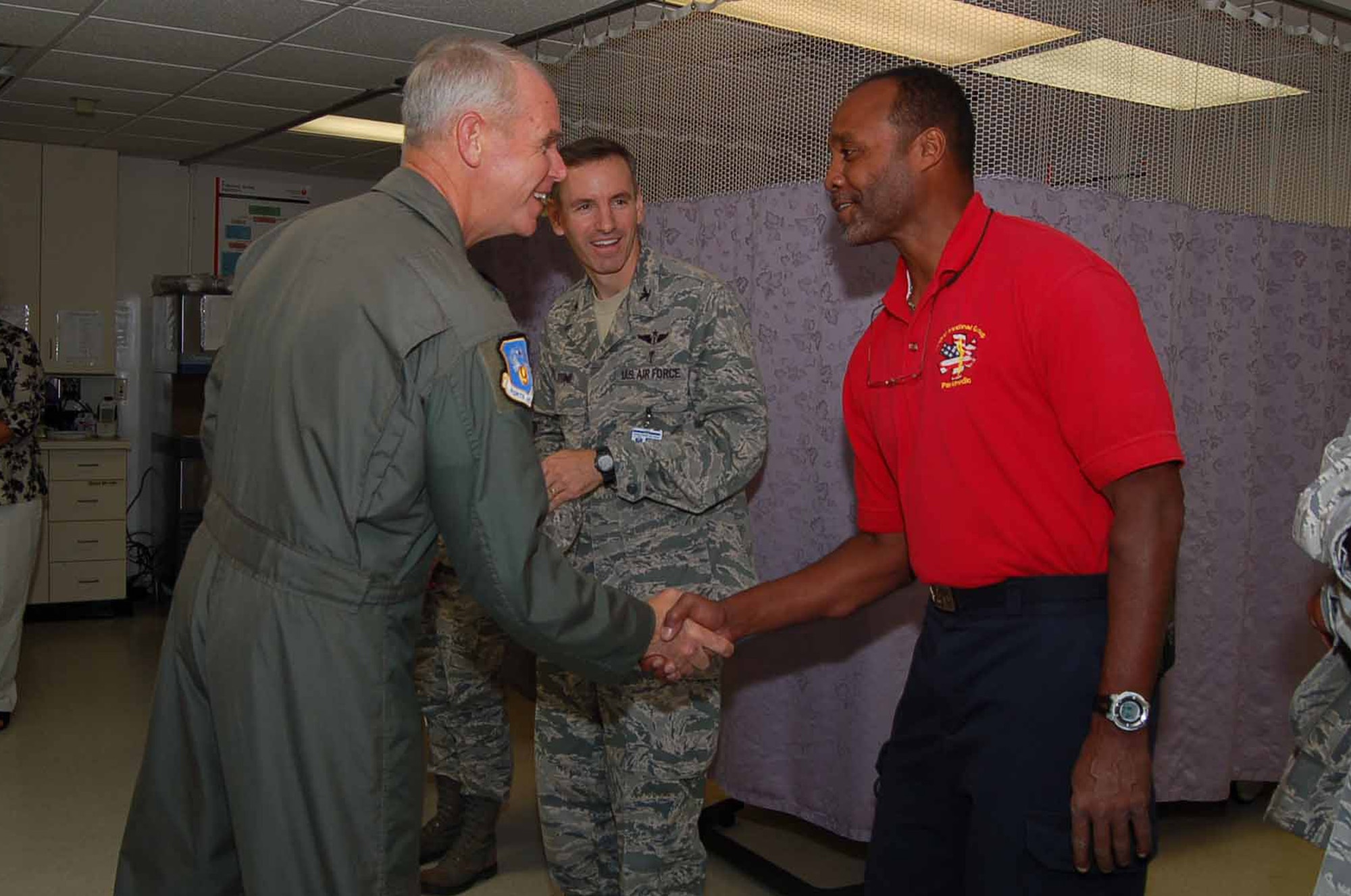 LANGLEY AIR FORCE BASE, Va.—Maj. Gen. William L. Holland, 9th Air Force commander, greets Elvin Deloach, paramedic foreman at the 633d Medical Group hospital emergency room, July 30.   Gen. Holland toured the hospital during his three-day visit to Joint Base Langley-Eustis .  (U.S. Air Force Photo/Master Sgt. Anna Hayman)