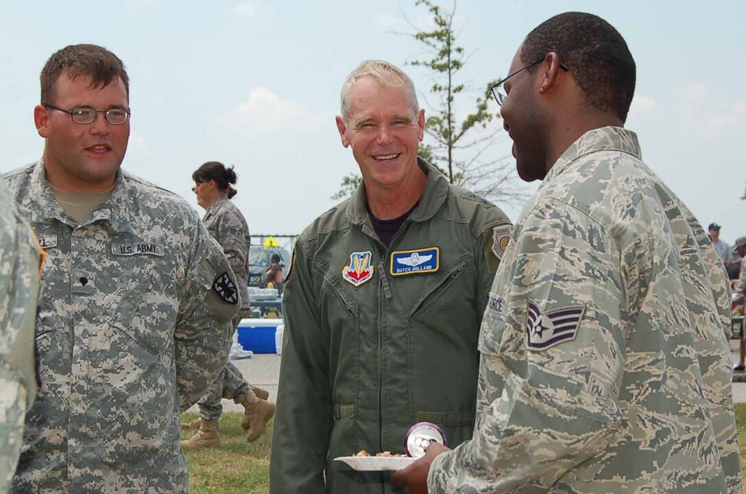 LANGLEY AIR FORCE BASE, Va.—Specialist Andrew Mitchell of the 149th Transportation Company,  10th Transportation Battalion, 7th Sustainment Brigade, and Staff Sgt. Dewayne Cannon of  the 633d Mission Support Group speak with Maj. Gen. William L. Holland, 9th Air Force commander, during Junior Enlisted Appreciation Day July 29.  Agencies across the base joined forces to provide a day of food, fun and entertainment to thank military member in the ranks of E-1 through E-6 for their daily contributions in accomplishing the mission of Joint Base Langley Eustis. (U.S. Air Force photo/Master Sgt. Anna Hayman)