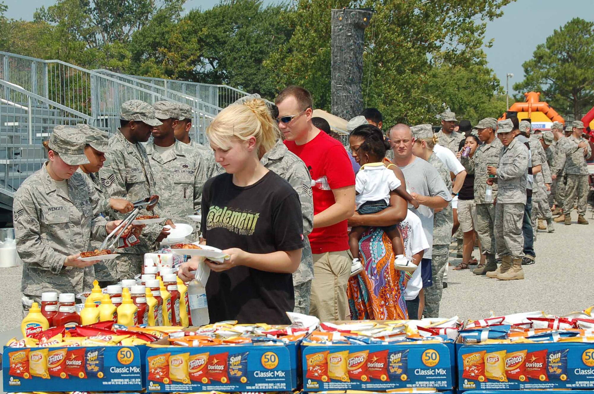 LANGLEY AIR FORCE BASE, Va.—Junior enlisted members of Team Langley come out in force to enjoy a barbecue during Junior Enlisted Appreciation Day July 29.  Agencies across the base joined forces to provide a day of food, fun and entertainment to thank military member in the ranks of E-1 through E-6 for their daily contributions in accomplishing the mission of Joint Base Langley-Eustis. (U.S. Air Force photo/Master Sgt. Anna Hayman)