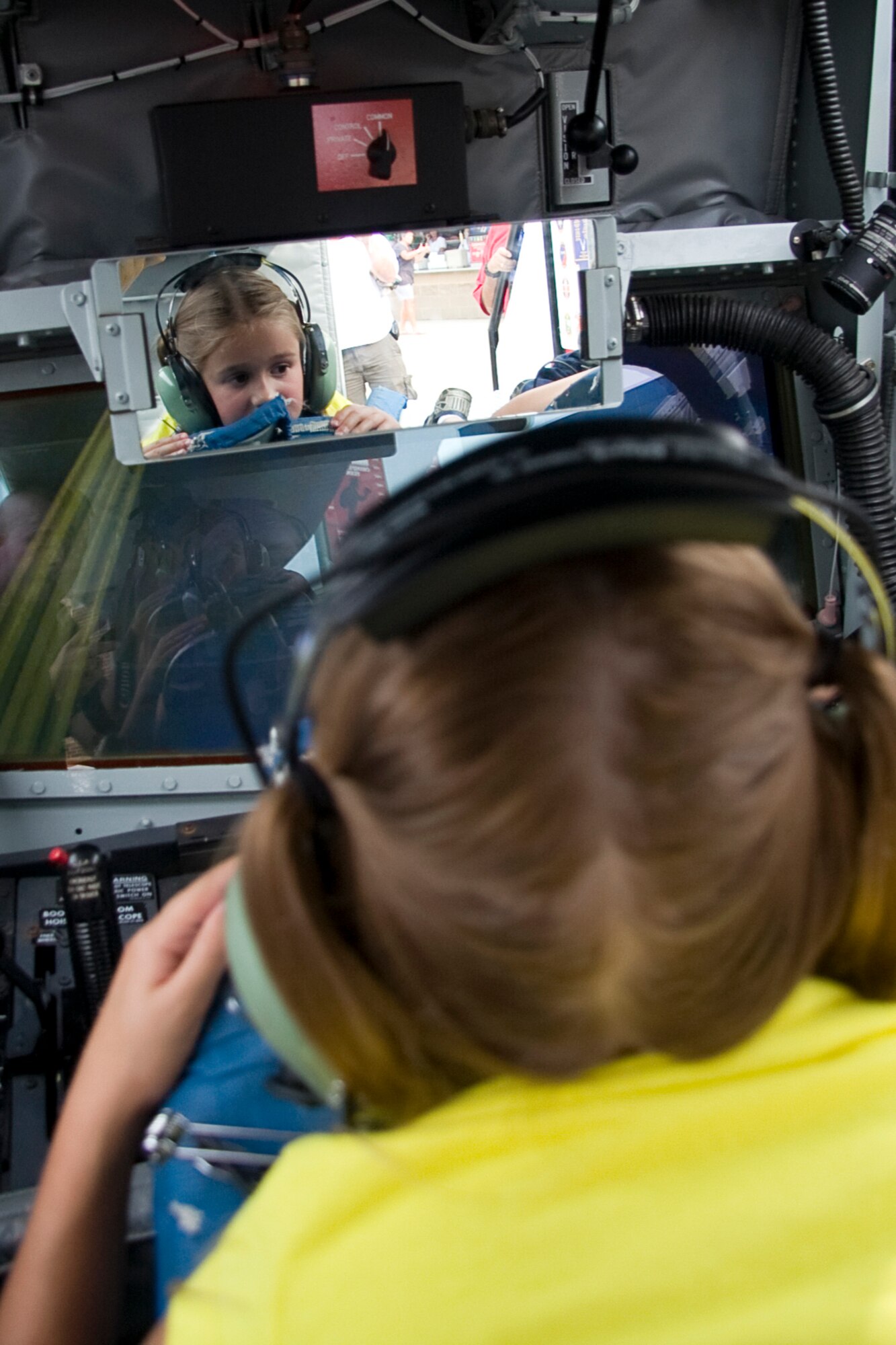 GRISSOM AIR RESERVE BASE, Ind. -- Kennedy Fisher, 6, watches and listens to an aerial refueling mission that is being played on a screen in a KC-135R Stratotanker boom pod simulator July 22. Ms. Fisher was able to climb inside and get a hands-on experience of what Airmen from the 434th Air Refueling Wing do every day. Both the boom pod and flight deck simulators were on display during an Indianapolis Indians game at Victory Field in Indianapolis.  (U.S. Air Force photo/Tech. Sgt. Mark R. W. Orders-Woempner) 