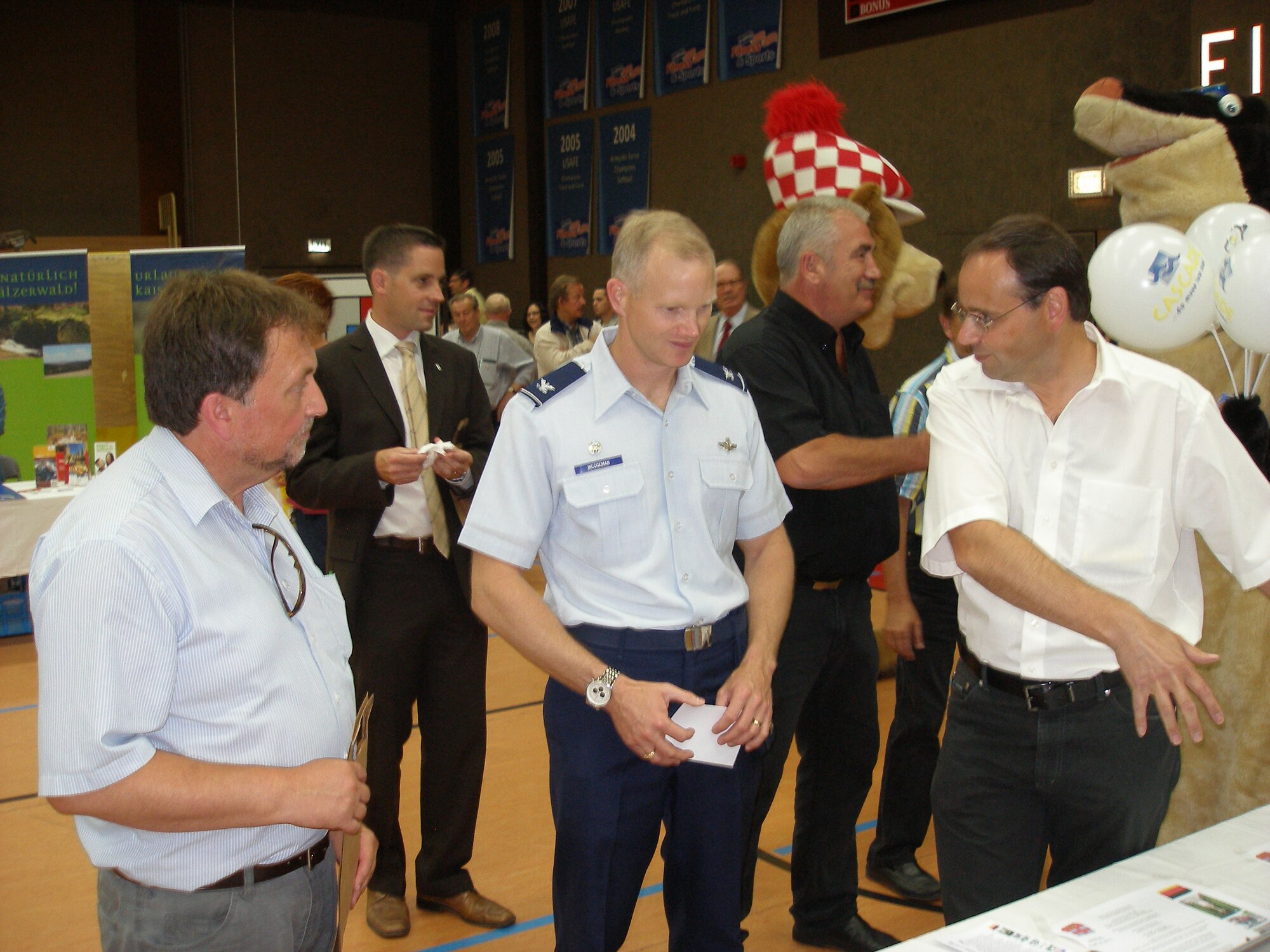 Walter Faber, the mayor of the neighboring community Binsfeld, provides information about historical attractions in his community to 52nd Fighter Wing commander, Col. Christopher Weggeman. Base members are invited to participate in an Explore the Eifel Binsfeld excursion Aug. 6. The event does not require registration and starts at 2 p.m. from the community hall located on Peter von Binsfeld Strasse. (Courtesy photo by Hillarius Esch)