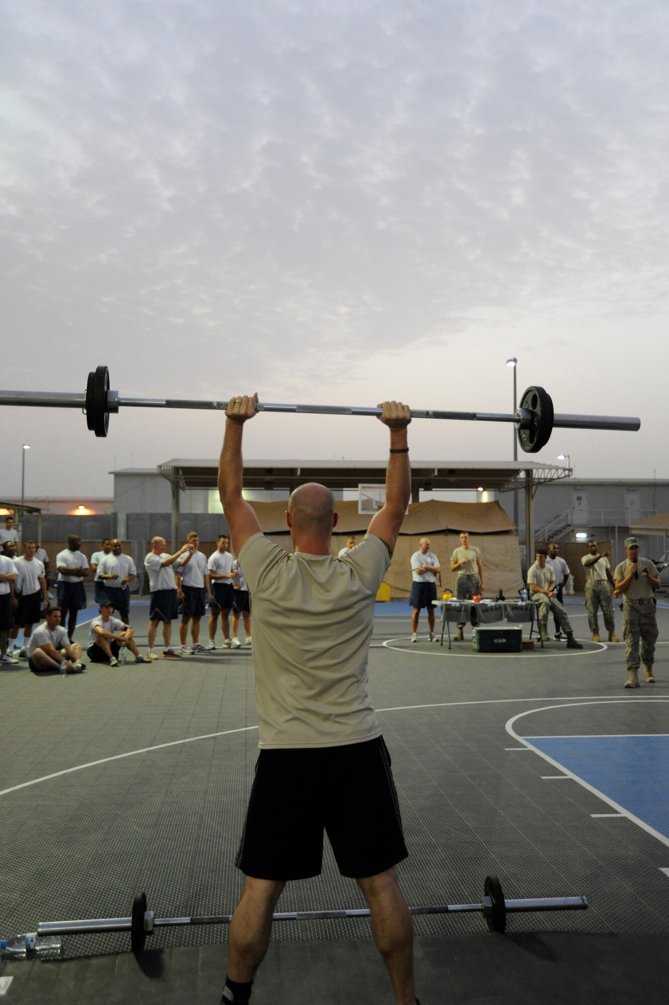 Special Agent John Menanno, Air Force Office of Special Investigations, competes in the Fight Gone Bad Crossfit Challenge at an undisclosed location in Southwest Asia. (U.S. Air Force photo/ Staff Sgt. Thomas Kessler)    