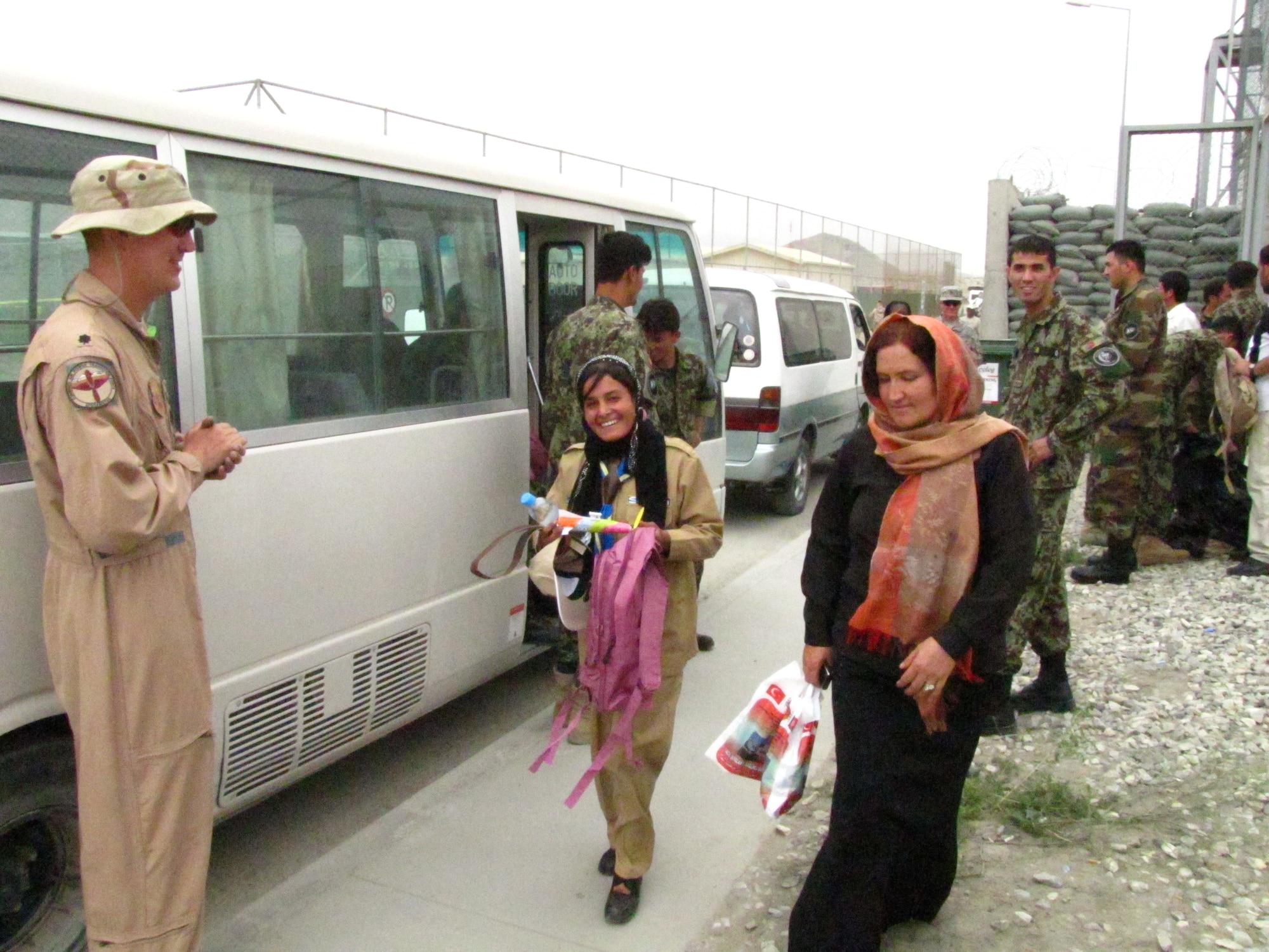 KABUL, Afghanistan - Afghan Air Force Lieutenants provided a new backpack filled with school supplies to each scout as they leave the Space Rocket Derby on ISAF Joint Command Base on Aug 1st, 2010. (U.S. Air Force photo by Capt. Rob Leese/RELEASED).
