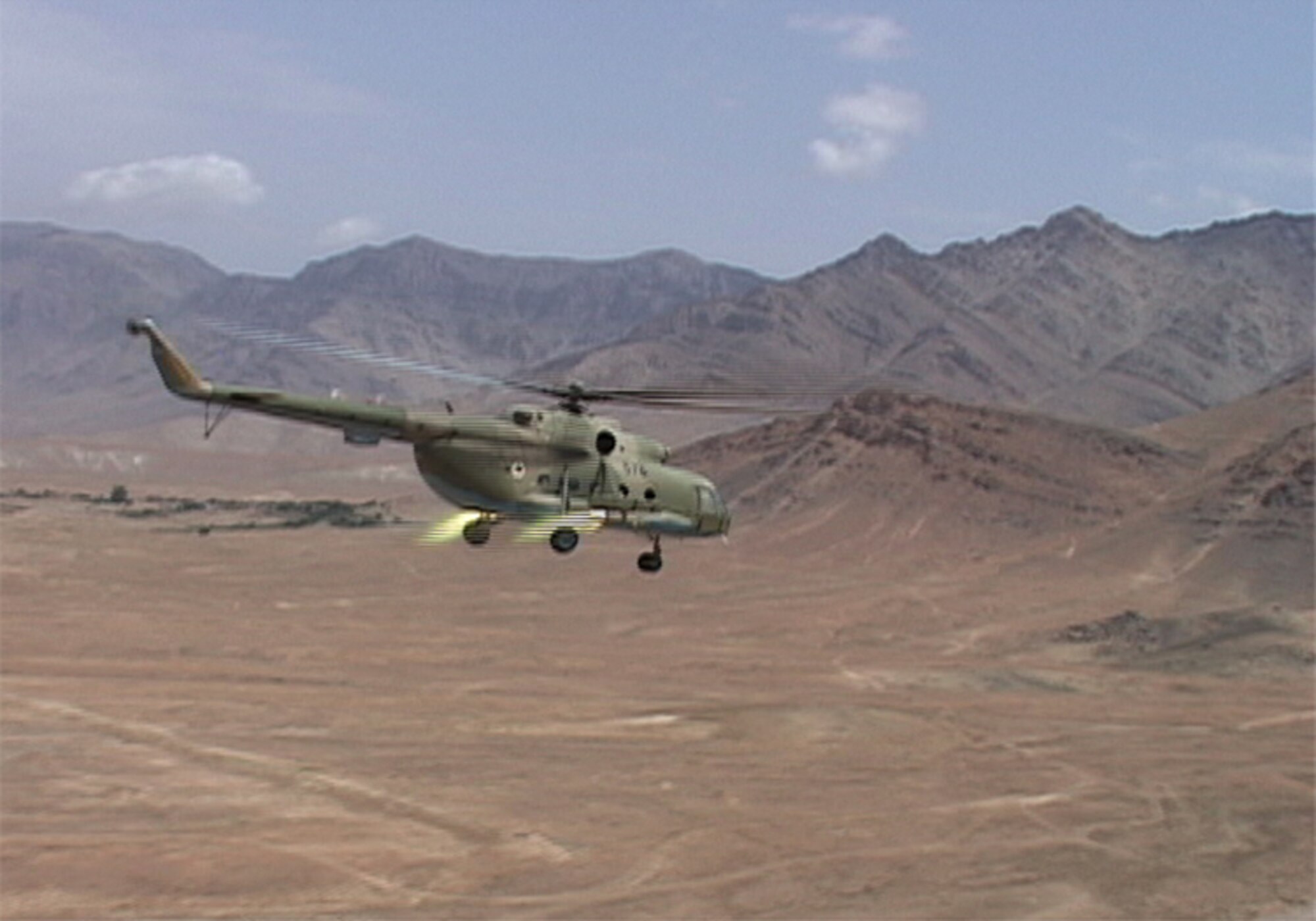 Afghan Air Force Mi-17 performs the first live fire training at the Kabul Military Training Center in Kabul on August 1, 2010 (U.S. Navy photo by Mass Communications Specialist First Class Elizabeth Burke/RELEASED).