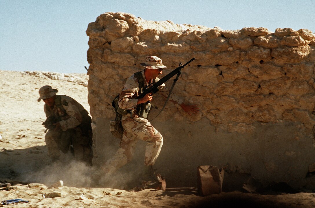 U.S. Army soldiers assigned to the 101st Airborne Division's Company A, 3rd Battalion, 502nd Infantry Regiment take part in an urban warfare training exercise in an abandoned town during Operation Desert Shield. 