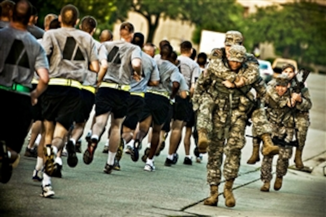 U.S. Army 1st Cavalry Division soldiers tough out the last mile of a 2.5-mile "buddy run" on Fort Hood, Texas, July 27, 2010. The soldiers are trying out for the 2nd Battalion, 38th Cavalry Regiment's Long Range Surveillance, an airborne unit on Fort Hood. 