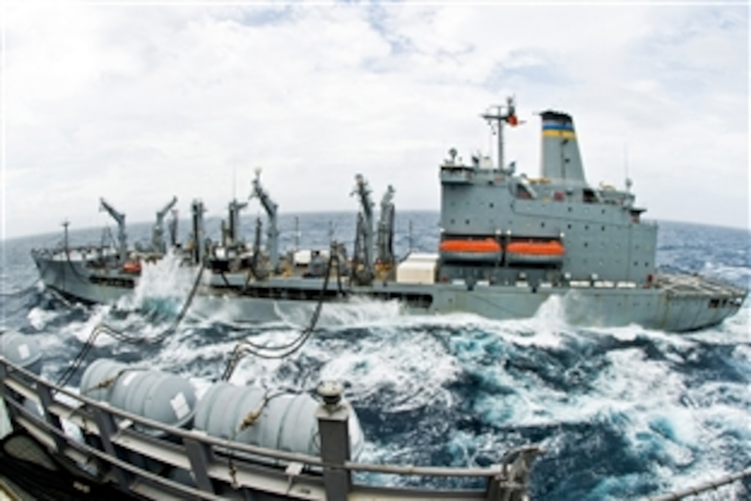 The Military Sealift Command fleet replenishment oiler USNS Walter S. Diehl transits alongside the aircraft carrier USS George Washington during a replenishment at sea in the western Pacific Ocean, July 30, 2010. The George Washington, the Navy's only permanently forward-deployed aircraft carrier, is under way helping to ensure security and stability.