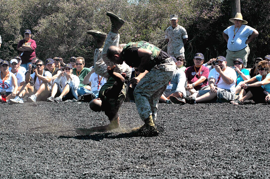 Sgt. Ricardo Lomeli,Marine Corps Martial Arts instructor trainer, Marine Corps Martial Arts Satellite School, Support Battalion, Recruit Training Regiment, right, throws fellow instructor trainer, Staff Sgt. Gustavo Hernandez, left, during a MCMAP demonstration for the Educator's Workshop.